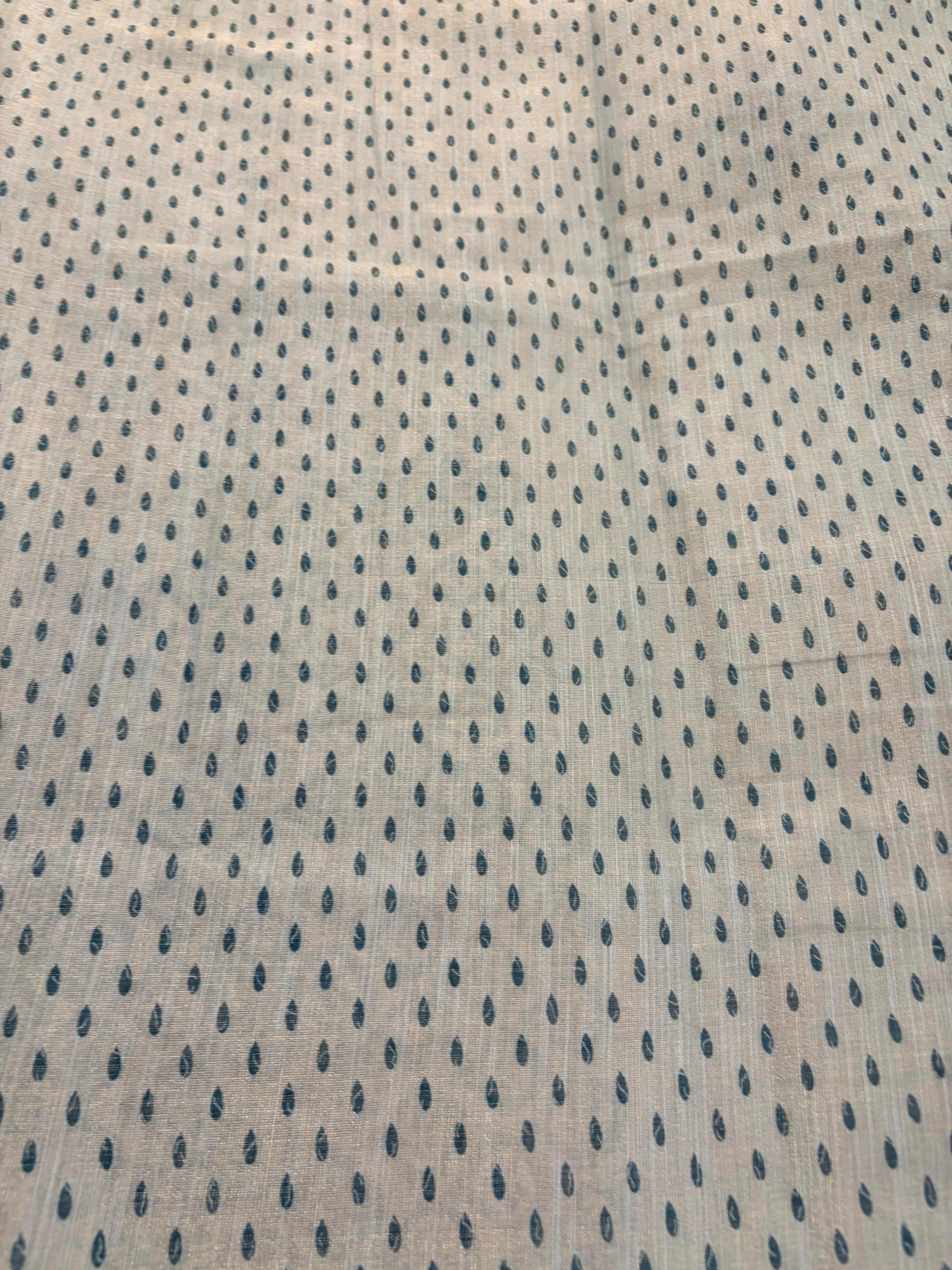 Textured fabric with a subtle pattern on a beige background